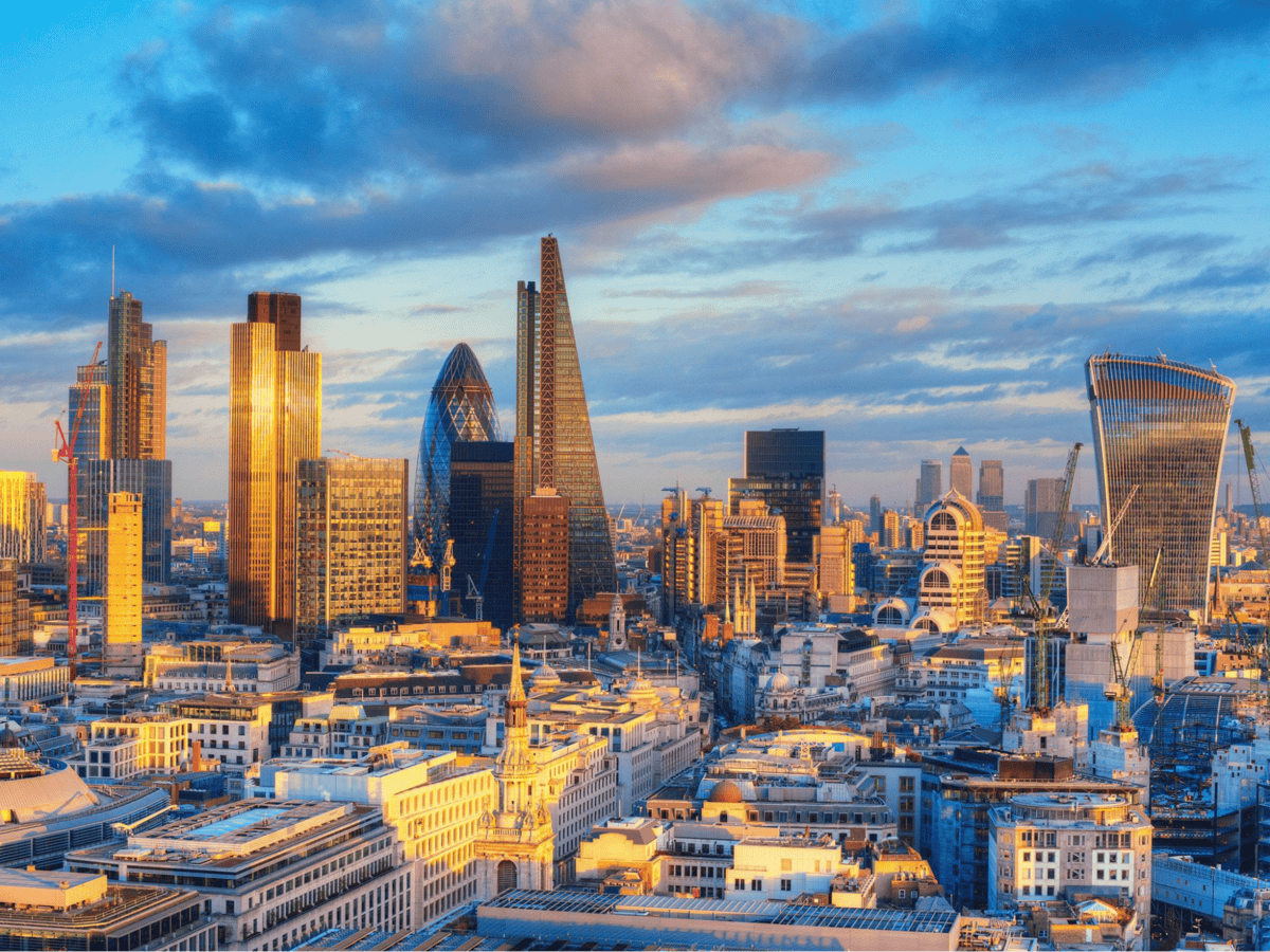 Aerial view of London city skyline at sunset.