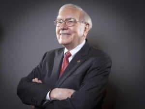 Warren Buffett, the world-renowned investor and CEO of Berkshire Hathaway, smiles for the camera
