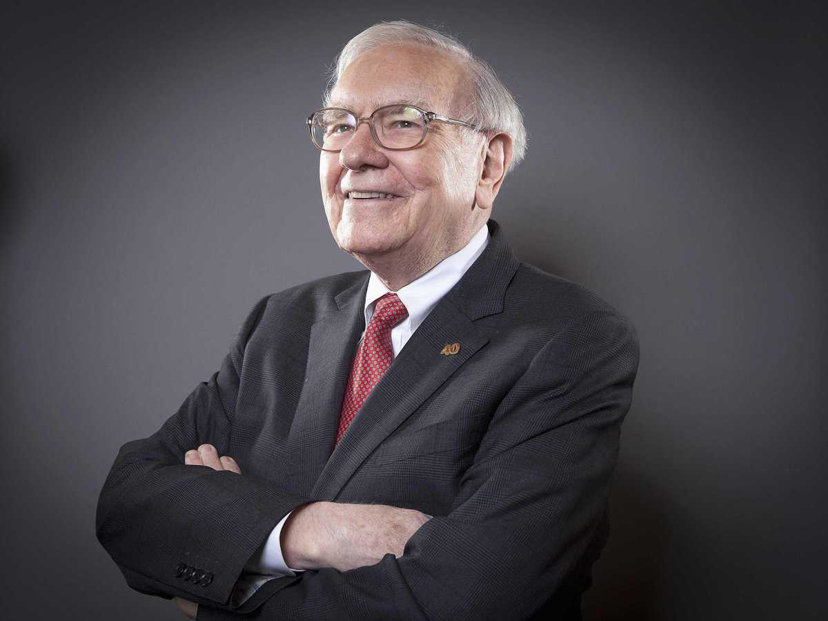 Warren Buffett, the world-renowned investor and CEO of Berkshire Hathaway, smiles for the camera